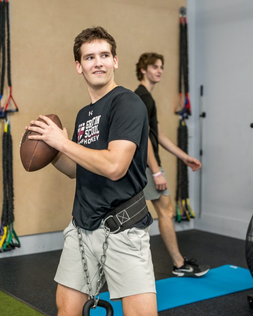 High school football player training in the WHS training center
