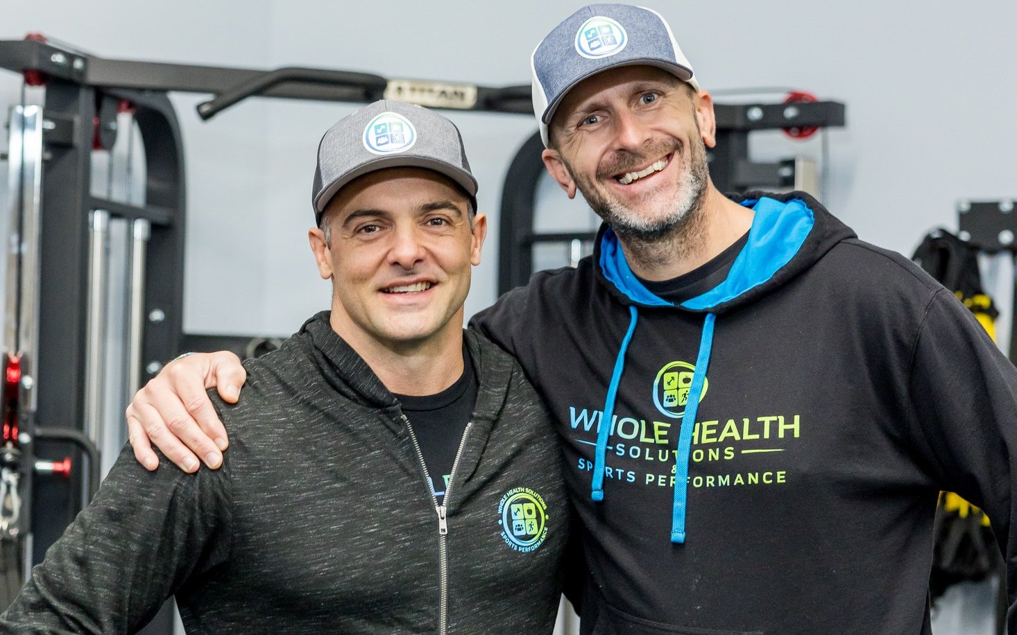 Two WHS clinicians smiling together in the training center